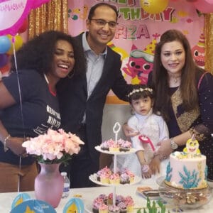 Danish's family cutting the cake at their daughter's second birthday party