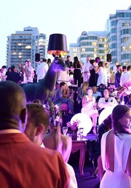 Guests at an evening rooftop reception